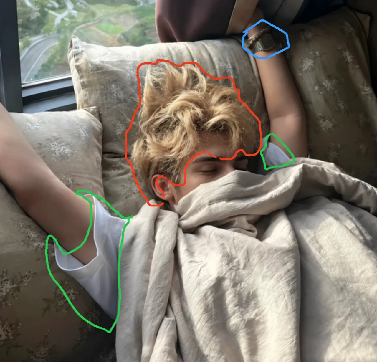 Colored outlines marking hair, shirt, and watch in a reclining portrait