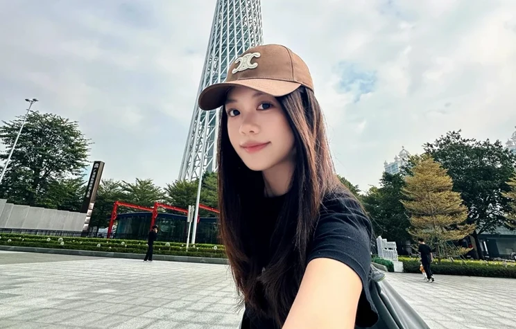 Selfie in a plaza in front of a tall tower
